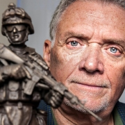 U.S. Marines veteran Steve Wilburn holds a statue presented to him by the Folds of Honor Foundation.