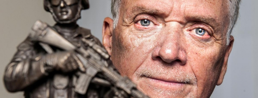 U.S. Marines veteran Steve Wilburn holds a statue presented to him by the Folds of Honor Foundation.